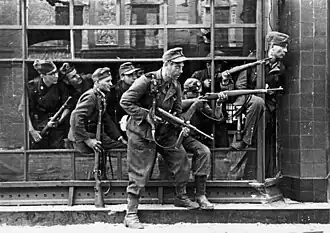 Members of the SS-Sonderregiment Dirlewanger fighting in Warsaw, pictured in window of a townhouse at Focha Street, August 1944