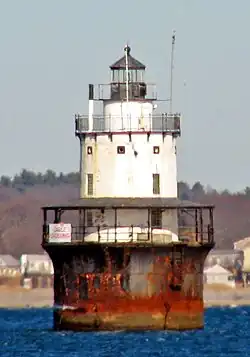 Butler Flats Light stands in open water about 15 feet (4.6&nbsp;m) deep, about 1,800 feet (550&nbsp;m) from land