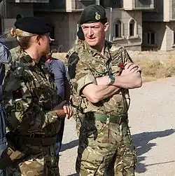 United Kingdom Maj. Gen. Rupert Jones, Deputy Commander – Strategy and Support, Combined Joint Task Force – Operation Inherent Resolve, (CJTF-OIR),speaks with a British explosive ordnance disposal trainer during a visit near Erbil, Iraq, 7 November 2016. CJTF-OIR is a multinational effort to weaken and destroy Islamic State in Iraq and the Levant operations in the Middle East region and around the world. (US Army photo by Sgt. Lisa Soy)
