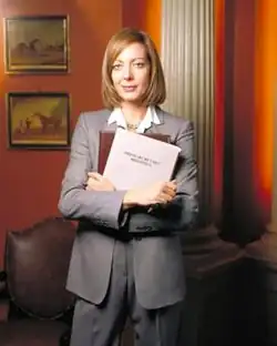 Allison Janney, pictured in costume as C.&nbsp;J. Cregg, for a promotional shoot