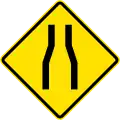 PF-1a Road narrows ahead on both sides