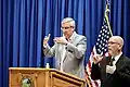 Indiana Governor Eric Holcomb (left) and American Sign Language interpreter
