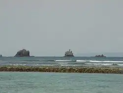 A view across the lagoon to Gili Tepekong, Gili Biaha and Gili Mimpang, three uninhabited islets popular with divers and local fishermen.