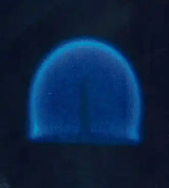 A candle in a microgravity environment. This is a rare example of a diffusion flame which does not produce much soot and does not therefore have a typical yellow flame