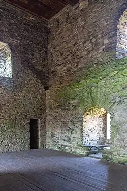 The keep interior looking south-west. A shadow halfway up the left wall marks the position of the original roof.