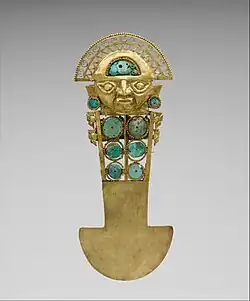 Ceremonial knife/tumi (Sican); 10th–13th century; gold, turquoise, greenstone and shell; height: 33&nbsp;cm; Metropolitan Museum of Art[73]