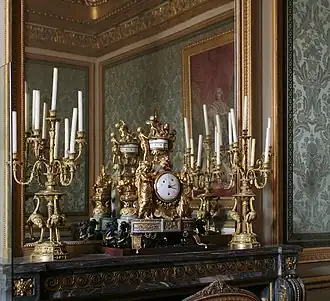 A garniture of an ormolu clock and candelabra at the Palace of Versailles in France