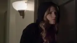 Actress Vanessa Ray as CeCe Drake eavesdropping on a conversation, using a black hoodie, blonde hair.