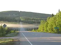 Chena Hot Springs Road runs through the CDP for 11.6 miles (18.7&nbsp;km), from its intersection with the Steese Expressway to its crossing of the Little Chena River. This view looks eastbound at the intersection of CHSR with Nordale Road.