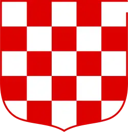 a red and white checkerboard shield