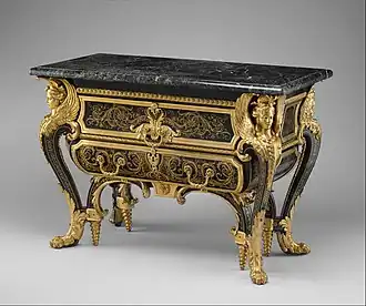 Commode; by André Charles Boulle; c. 1710–1732; walnut veneered with ebony and marquetry of engraved brass and tortoiseshell, gilt-bronze mounts, antique marble top; 87.6 x 128.3 x 62.9&nbsp;cm; Metropolitan Museum of Art[172]