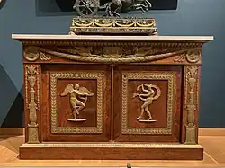Commode with two door panels; before 1805; mahogany with bronze mounts; 1.165 x 1.794 x 0.83 m; Louvre[12]