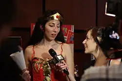 Journalist interviews a cosplayer, 2012.