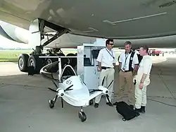 A Colomban Cri-Cri (F-PRCQ) MC-15 Cri Cri (Cricket) exhibited under an Airbus A380 at the 2011 MAKS airshow, the world's first all-electric (CO2-neutral) 4-engine aircraft developed by EADS Innovation Works and manufactured by Aero Composites Saintonge.