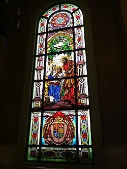 Stained glass window of the family of Mary, with Saints Anne and Joachim.