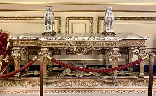 Large console with central projection; by Benjamin Deguil and Benjamin-Paul Ramillon; 1850–1875; gilt wood and marble; 100 x 283 x 77&nbsp;cm; Napoleon III Apartments, Louvre Palace, Paris[170]