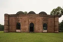 Three domes and three entrances at side of the mosque