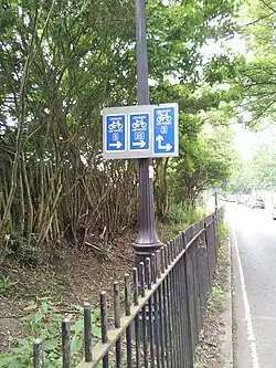 Direction signs for multiple London Cycle Network routes.