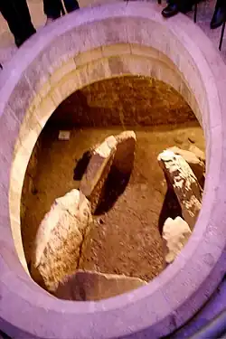 The dolmen, now visible through the chapel floor.