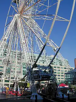 Four-car 30&nbsp;m tall drive-in Ferris wheel at Harbourfront, Toronto, Canada, in 2004[185]