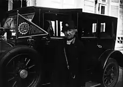 Duchesse d'Uzès - president of l'Automobile Club féminin in 1927, posing next to an ACFF pennant attached to the bonnet of a car