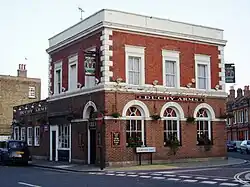 Photograph of a two-storey red brick building with signage indicating it is a pub called the Duchy Arms