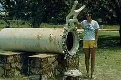 A horizontal cylinder, just large enough to contain one person, with an hinged door clamp at one end