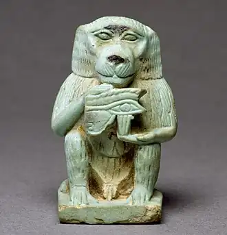 Amulet that depicts Thoth as a baboon holding the Eye of Horus; 664–332&nbsp;BC; Egyptian faience with light green glaze; height: 3.9&nbsp;cm, width: 2.4&nbsp;cm, depth: 2.5&nbsp;cm; Walters Art Museum (Baltimore, US)