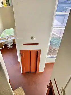 View of one of the building's elevators from a balcony