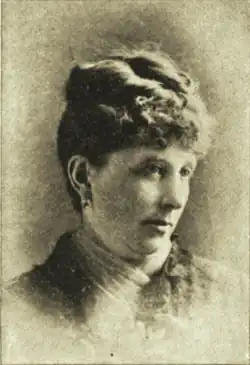 B&W portrait photo of a woman with her hair in an up-do.