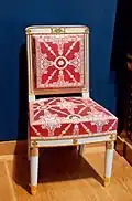 Chair; before 1810; white trimmed wood with gilt carved decoration, modern trim, red and white silk; 90 x 50.5 x 44&nbsp;cm; Louvre[15]