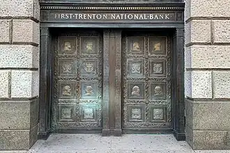 Bronze doors at One West State Street, featuring bas-relief portraits of George Washington, Marquis de Lafayette, Alexander Hamilton, and Benjamin Franklin.