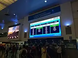 Interior of the station building with ticket office and schedule board