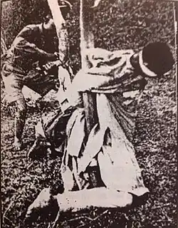 A victim tied to a tree