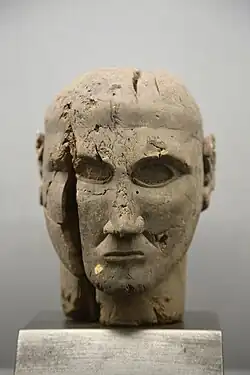 Etruscan pear wood head, 7th century BC