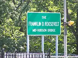 Sign bearing the official name of the span