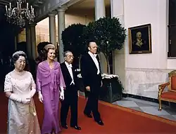 President Gerald Ford, First Lady Betty Ford, Japanese Emperor Hirohito and Empress Nagako walk to the East Room prior to a state dinner, 1975