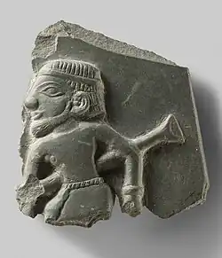 Fragment of a ceremonial palette illustrating a man and a type of staff. Circa 3200–3100 BC, Predynastic, Late Naqada III.