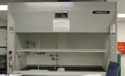 A white metal enclosure with a partially-opened glass sash at front