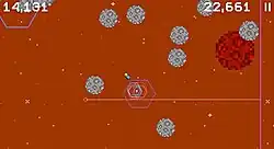 Pixelated asteroids crowd the screen. A dot representing the player's rocket is near the center.