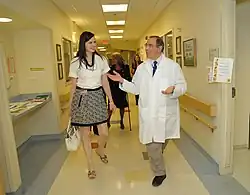 Davis and Gallin walking in a hospital hall