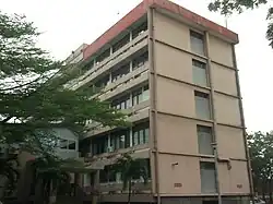 Tan, five-story building