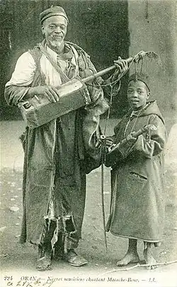 Oran, Algeria, early 20th century. The geumbri is also an instrument of Morocco, used in Gnawa ceremonies.