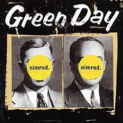 Two black and white pictures of men in suits and ties are placed side by side with a beige-colored outline atop a grainy black background. The men's faces are obscured by two yellow circles inscribed with the phrase "nimrod." At the top of the image, "Green Day" is written in white lettering.