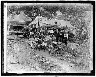 Group of striking union miners & the families living in tents. Lick Creek, West Virginia during UMW General coal strike. -April 12, 1922