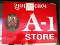 Gujarati and English sign on shop in English-speaking town in America, a Hindu talisman in the Gujarati language