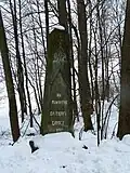 Monument in Guty built in 1898 to commemorate the construction of a road. Inscription is in Polish.