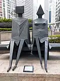 ’Sitting Couple’, 1989-1990, Bronze, by Lynn Chadwick, Exchange Square (Hong Kong)[69]