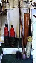 S.A.P. shells (left), cordite cartridge (lower right) and cartridge container (centre right) on HMS&nbsp;Belfast