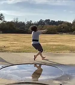 Athlete practicing the hammer throw event